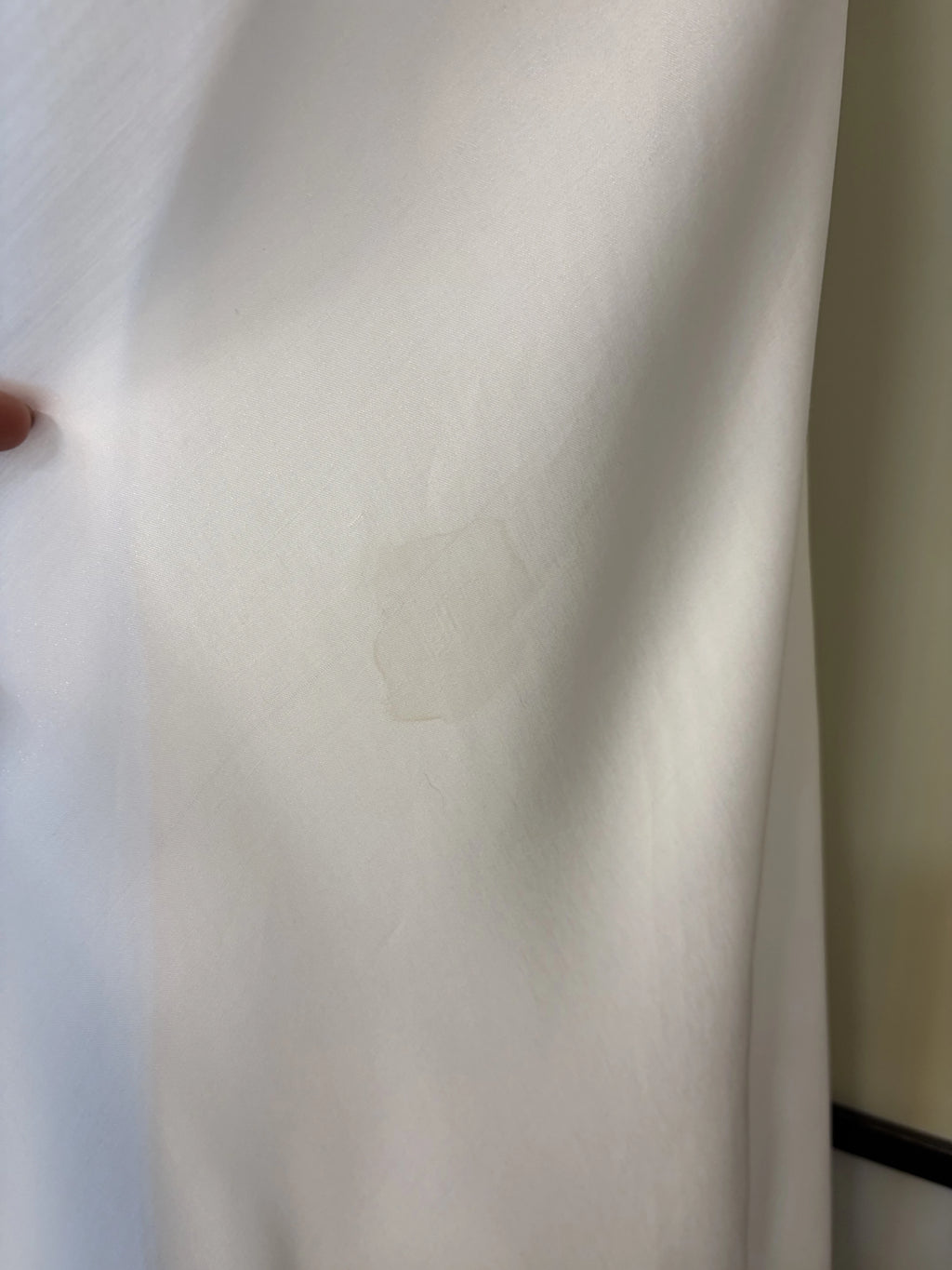 A white dress made of shimmering fabric