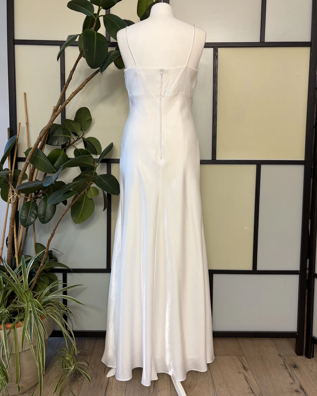 A white dress made of shimmering fabric