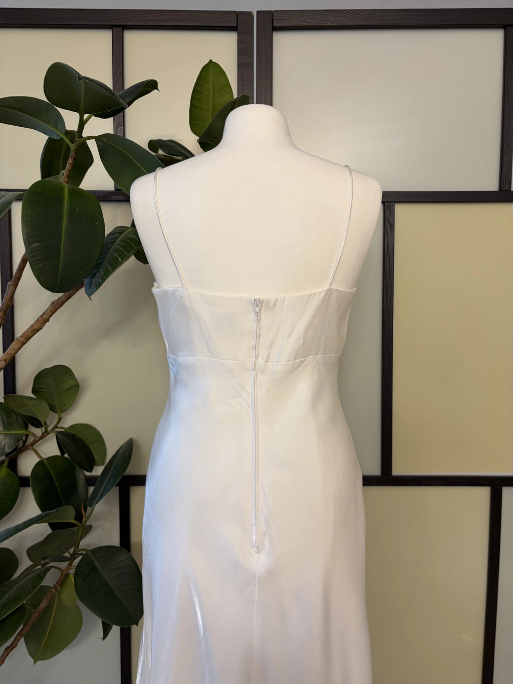 A white dress made of shimmering fabric