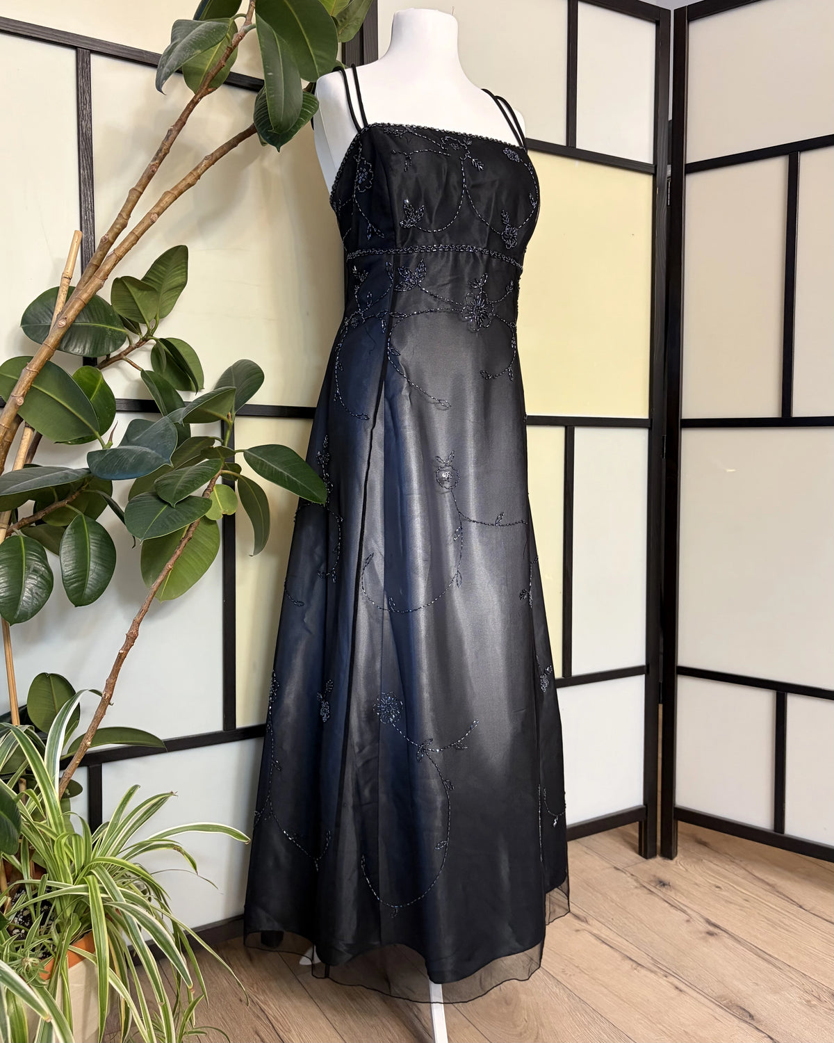 Black gradient dress richly decorated with floral beadwork