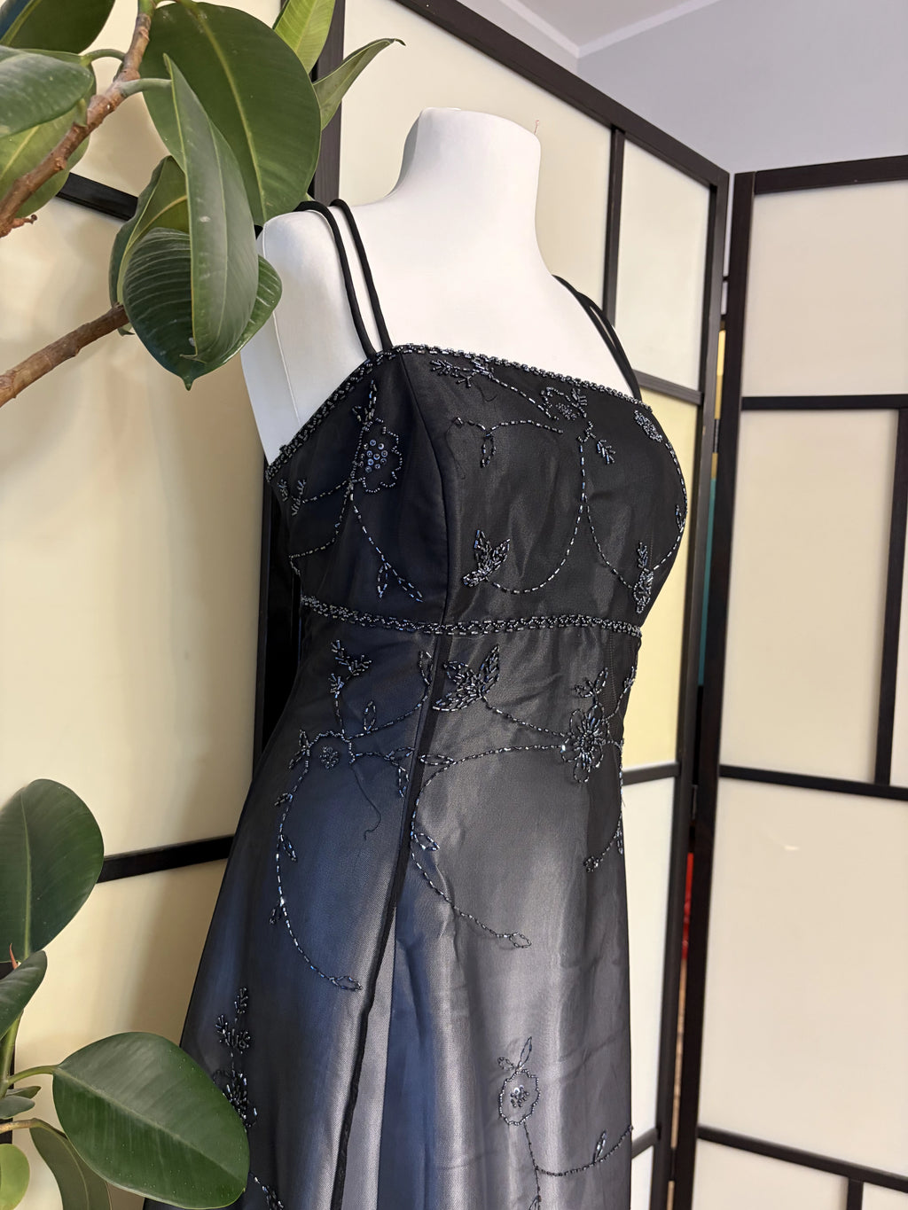 Black gradient dress richly decorated with floral beadwork