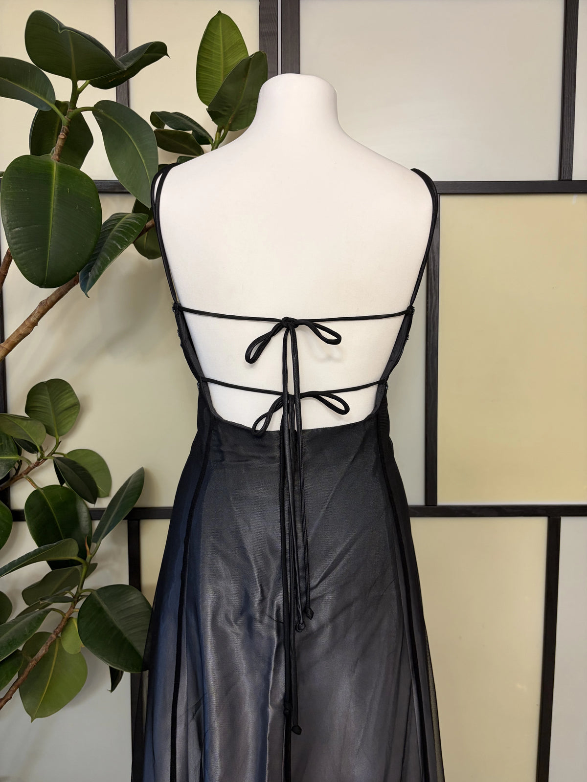 Black gradient dress richly decorated with floral beadwork